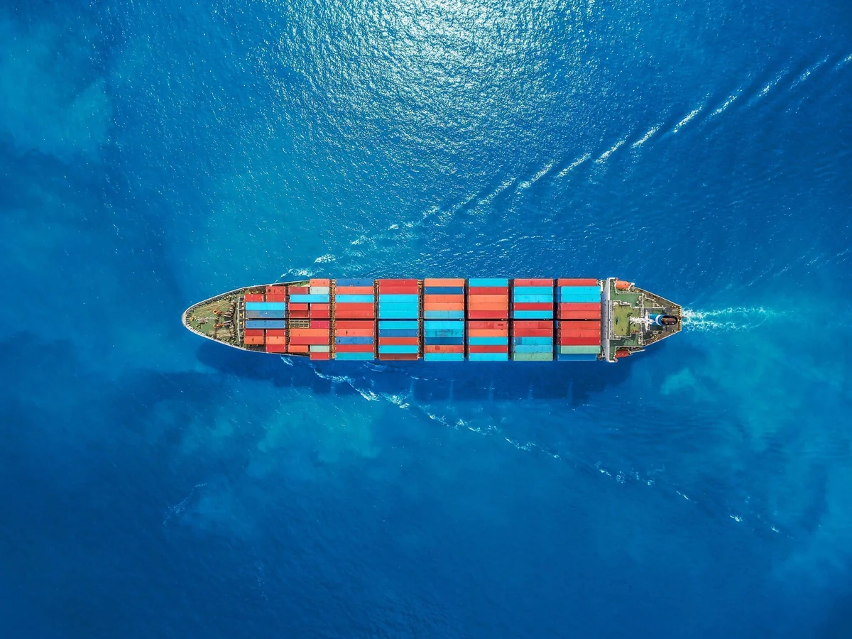 Cargo ship with containers from top view